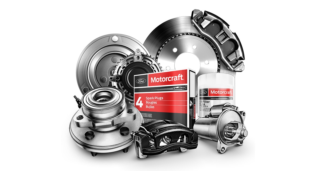 Assortment of Motorcraft parts including oil filter and spark plugs.