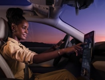 Woman in driver's seat of Mach-E.