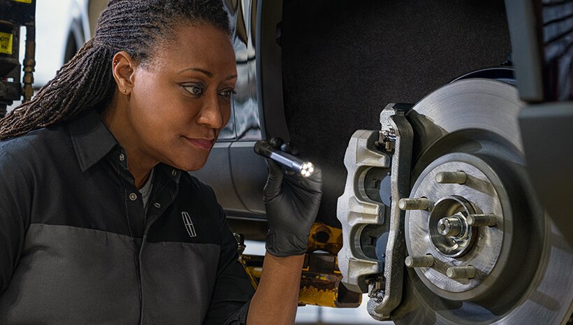 Technician working on vehicle