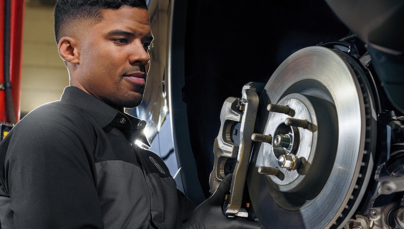 Technician working on brakes