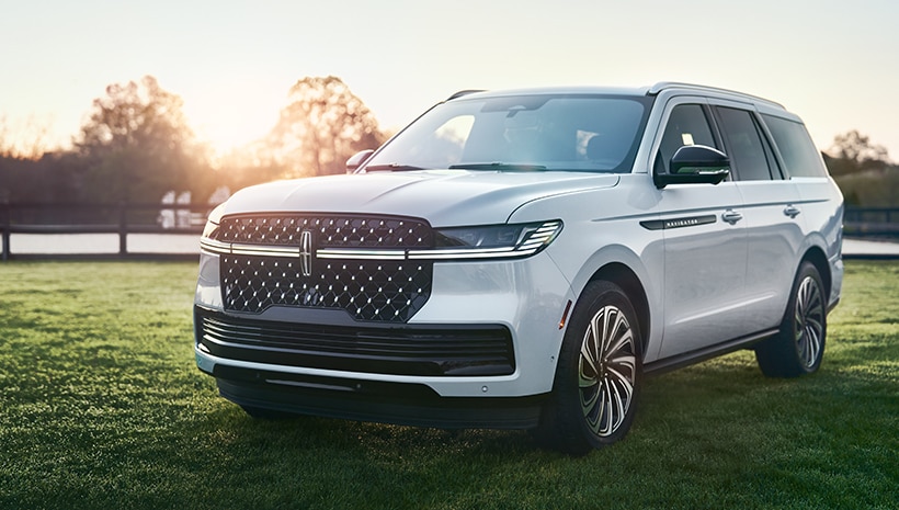Lincoln vehicle parked on grass