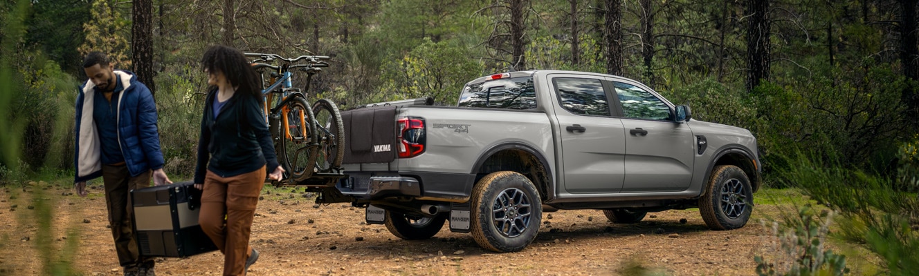 Two campers retrieve a cooler from their Ranger® pickup.
