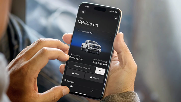 An F-150 owner checks their vehicle stats in the Ford app.